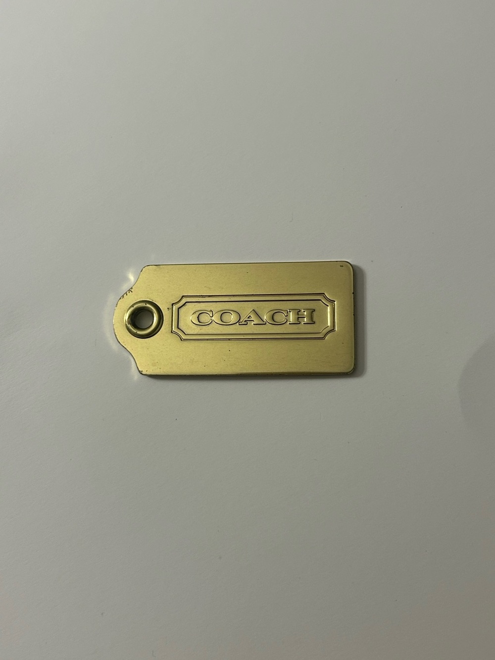 Coach Gold Tone Logo Tag Accent